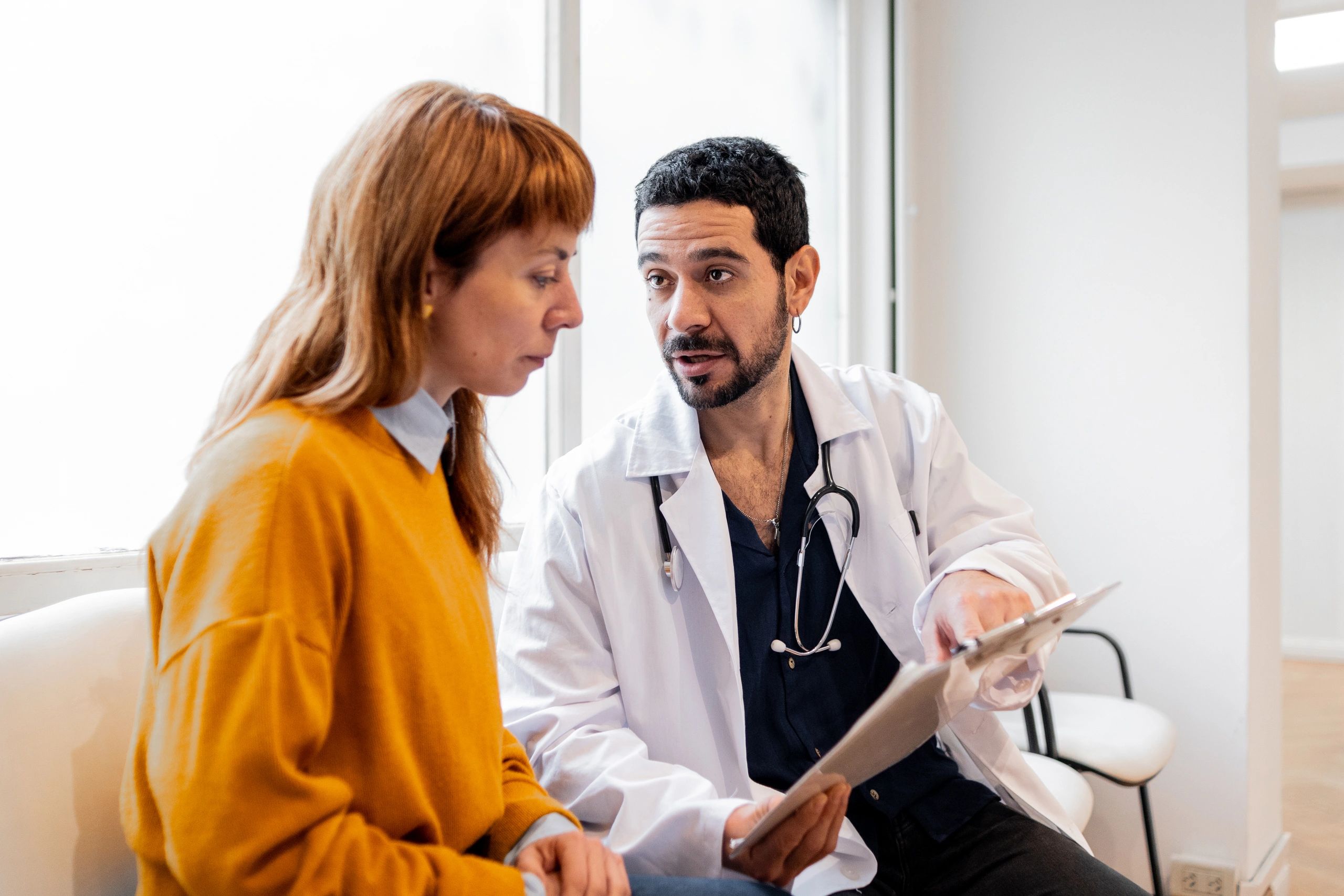 Doctor reviewing medical information with a patient